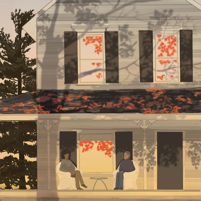 2 people siting on a porch in autumn
