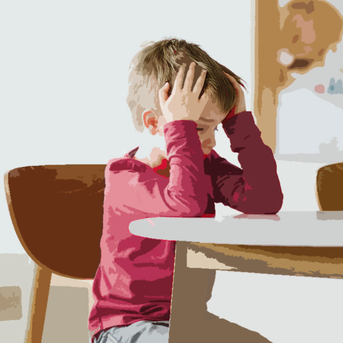 boy frustrated sitting at table